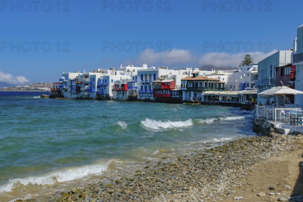 Mykonos, Cyclades, Greece - Little Venice is a picturesque neighborhood in Mykonos Town with colorful houses that stand right by the sea and are reminiscent of Venice. Little Venice is located on Alefkandra Bay next to the famous windmills of Mykonos. Mykonos is part of the Cyclades archipelago in the Aegean Sea
