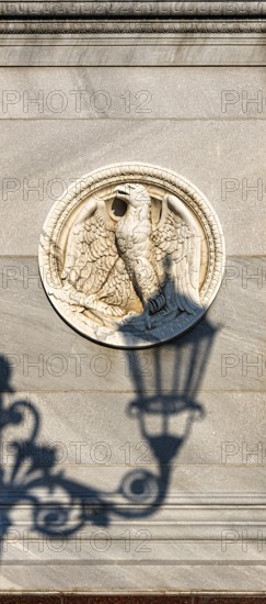The shadow of a street lamp on the pedestals of the group of figures on the Schlossbrücke, Unter den Linden, Berlin, Germany