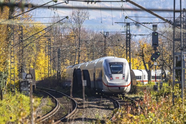 Intercity Express ICE. Open-route passenger train in the Stuttgart North Station area. Arched bridge and landscape in autumn. Stuttgart, Baden-Württemberg, Germany
