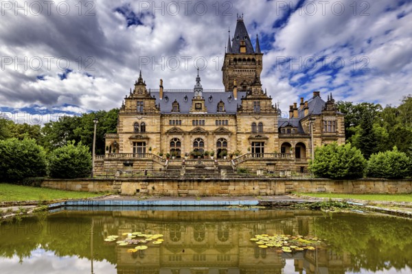 A majestic castle with mirror lake and cloudy sky, The Hummelshain hunting lodge in Thuringia