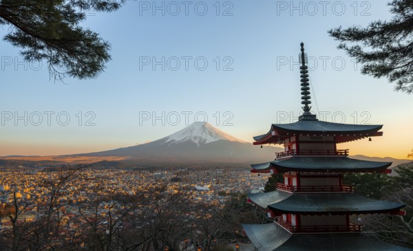 Five-story pagoda of a Shinto Shrine, Chureito Pagoda, with views of Fujiyoshida City and Mount Fuji volcano at sunset, Arakura Fuji Sengen Shrine, Arakurayama Sengen Park, Yamanashi Prefecture, Japan