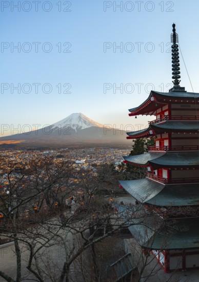 Five-story pagoda of a Shinto Shrine, Chureito Pagoda, with views of Fujiyoshida City and Mount Fuji volcano at sunset, Arakura Fuji Sengen Shrine, Arakurayama Sengen Park, Yamanashi Prefecture, Japan