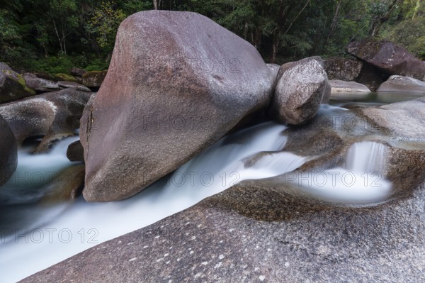 Turquoise blue water between rocks in the tropical rainforest of Babinda Boulders Queensland Australia