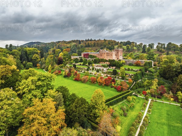 Autumn colours over Powis Castle and Garden from drone, Welshpool, Powys, Wales, England, United Kingdom