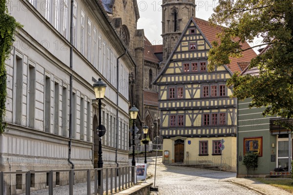 Charming old town with half-timbered houses and cobblestones under shady trees, The old town of Arnstadt in Thuringia