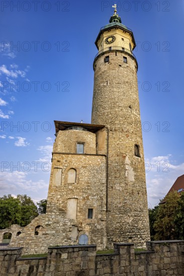 Stone wall and tower with old ruins under a blue, cloudy sky, The Niedeck Ruins in Arnstadt Thuringia