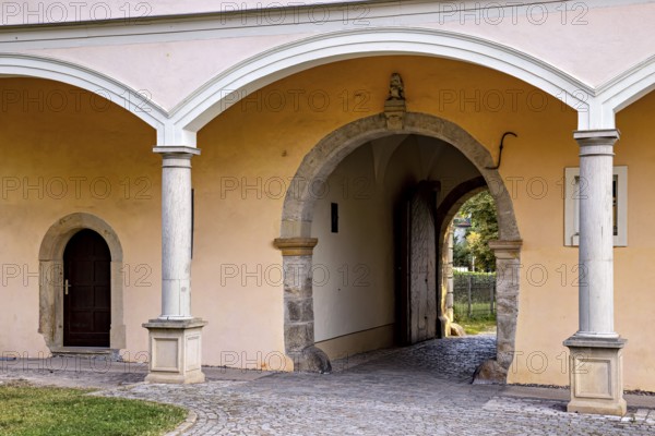 Close-up of an archway of a historic building with paved floor, gate to the district office in the old town of Arnstadt in Thuringia