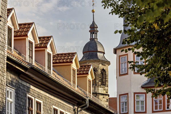 Church tower with traditional roofs and gables in an old town at sunset, The old town of Arnstadt in Thuringia