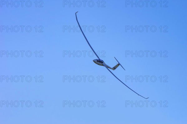 A Schempp-Hirth Arcus E motor glider, registration D-KWKU, during a screening as part of an air show at the Fliegerbergfest of the Rossfeld Luftsportverein in Metzingen-Glems, Baden-Württemberg, Germany, for editorial use only