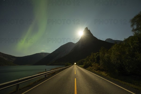 National mountain of Norway - Stetind in the Nordland under auroras and a full moon