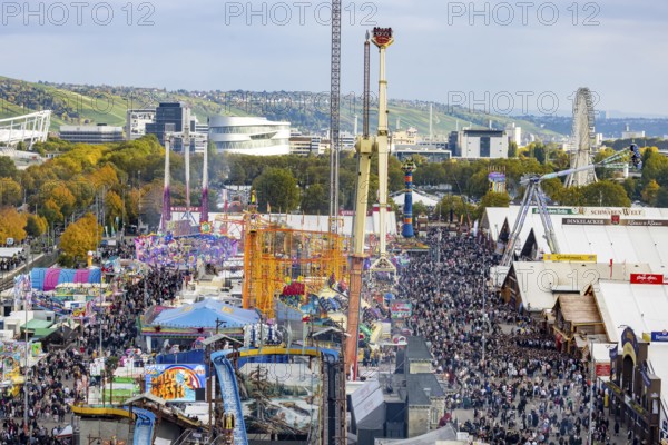 The 178th Cannstatter Volksfest on the Wasen attracted 4.2 million visitors. The Wasenrummel is one of the most important traditional festivals in Germany. In the background is the headquarters of Mercedes-Benz Group AG. Bad Cannstatt, Stuttgart, Baden-Württemberg, Germany