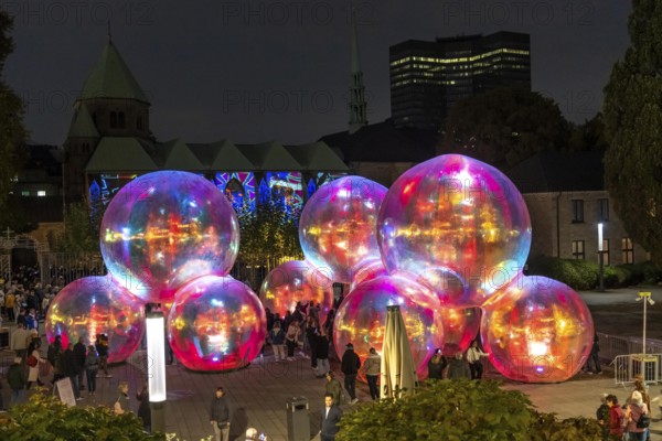 The 10th Essen Light Festival, in the city centre, second largest light art festival in Germany, light art on the Burgplatz, Evanescent light installation, by the Australian artist duo Atelier Sisu, large bubble-like spheres, with light and sound, town hall, cathedral, Essen, North Rhine-Westphalia, Germany