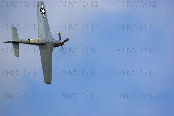 A North American P-51 Mustang of the flying group Flying Bulls, the Nooky Booky IV during an air show at the Rossfeld in Metzingen-Glems, Baden-Württemberg, Germany, for editorial use only