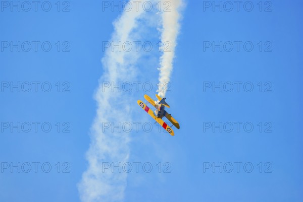 A Boeing-Stearman biplane during a flight demonstration as part of an air show at the Rossfeld in Metzingen-Glems, Baden-Württemberg, Germany, for editorial use only