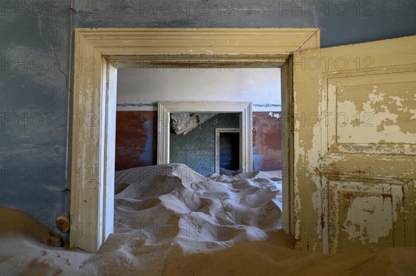 Sand mountains in a former dwelling house, interior photograph, Kolmanskop, restricted diamond area, near Lüderitz, Karas region, Namibia