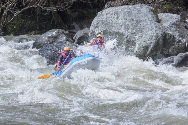 A group of people white water rafting, Costa Rica, Central America
