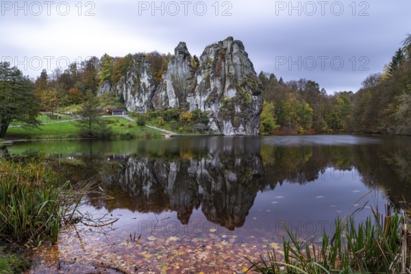 Externsteine in autumn, view over the Wiembecke pond, Teutoburg Forest, Horn-Bad Meinberg, North Rhine-Westphalia, Germany