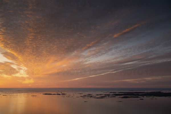 Offshore islands and skerries, sea, dramatically illuminated clouds, sunset, Otroya or Otrøya island, Møre og Romsdal, Norway