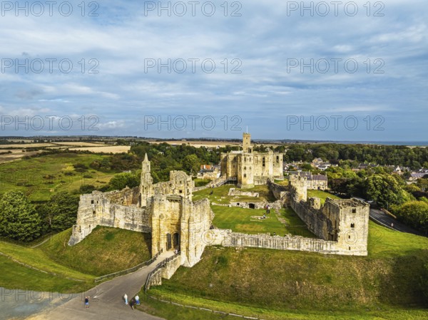 Warkworth Castle over River Coquet from a drone, Warkworth, Northumberland, England, United Kingdom