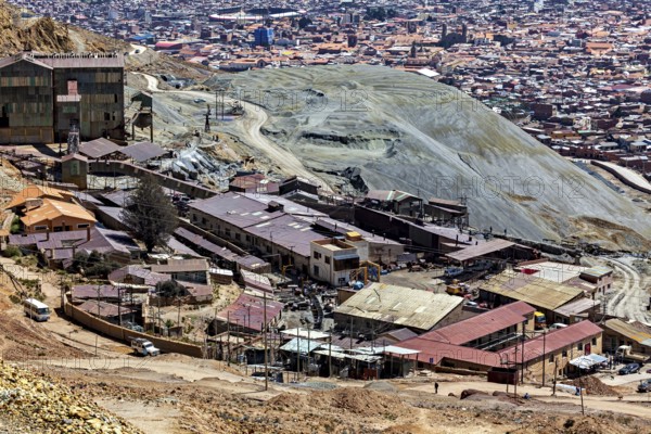 Extensive settlement area with industrial buildings in a barren hilly landscape, The silver mines of the Cerro Rico silver mountain near Potosi in Bolivia
