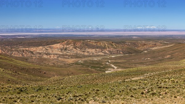 Vast desert landscape with hills and mountains in the distance, The landscape of the Altiplano in Bolivia