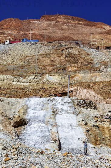Sky over a stony mountain with barren earth and visible power lines, The silver mines of Potosi Bolivia