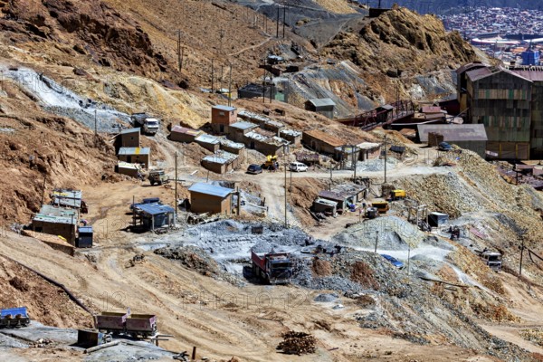 Mining area with scattered huts and lorries in an impassable terrain, The silver mines of Potosi Bolivia
