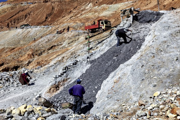 Workers moving stones on a construction site in a hilly environment, The silver mines of Potosi Bolivia