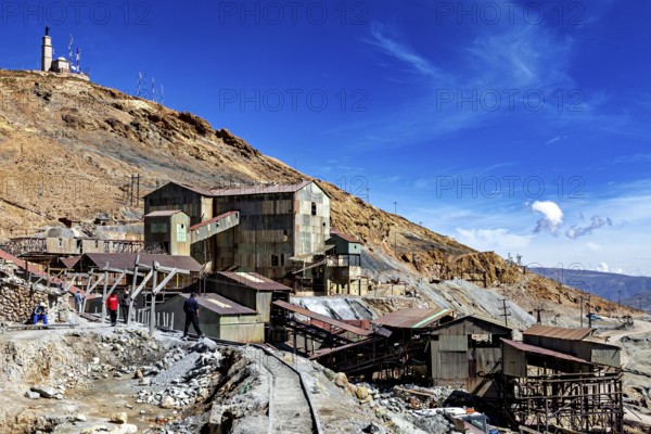 Old industrial plants in a rocky area under a clear blue sky, The silver mines of Potosi Bolivia