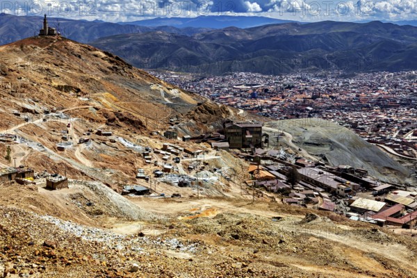 Far-reaching panorama of a city embedded in a mountainous landscape with clouds, The silver mines of the Cerro Rico silver mountain near Potosi in Bolivia