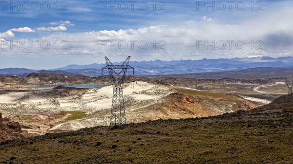 Power lines cross a vast, arid landscape, The landscape of the Altiplano in Bolivia