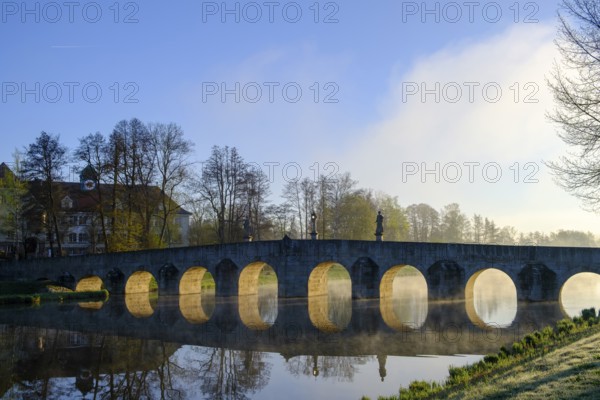 Morning atmosphere, fog at Fischhof, with historic Fischhof bridge, Tirschenreuth, Upper Palatinate, Bavaria, Germany