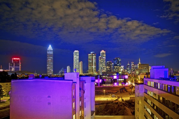 Rooftop day with colourfully illuminated houses for a techno party on the roof with a view of the skyline, Frankfurt am Main, Hesse, Germany