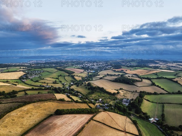 Sunset of Fields and Farms over Devon from a drone, Torquay, Torbay, Devon, England, United Kingdom