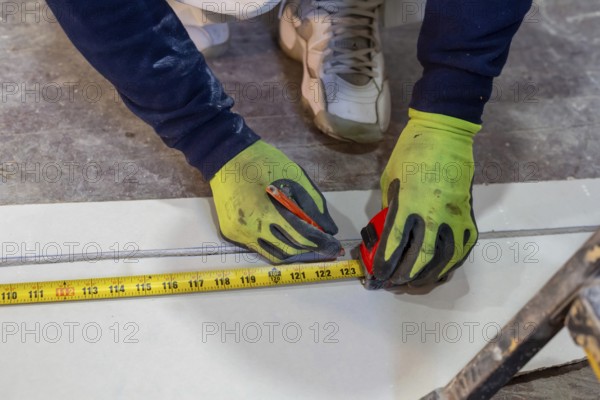 Detroit, Michigan - Workers remodel a house in the Morningside neighborhood that had been vacant for many years. Detroit lost nearly two-thirds of its residents from 1950 to 2020 but has been growing modestly in recent years