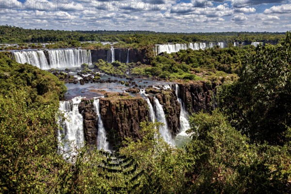 Panoramic views of a waterfall landscape, lush forests and dramatic differences in altitude, The Iguazu Falls between Argentina and Brazil