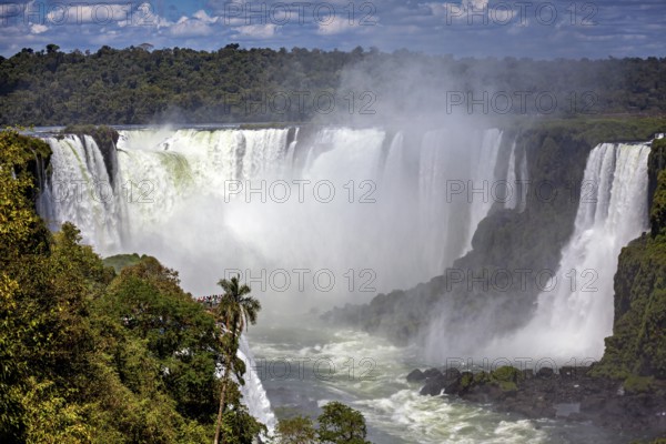 Massive waterfalls create dense fog, surrounded by jungle, The Iguazu Falls between Argentina and Brazil
