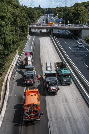 Rehabilitation of the A52 motorway near Essen, an 8 km long section between the Essen-Kettwig junction and the Essen-Ost motorway junction will be completely renovated over a period of 9 years, 6 lanes, new drainage pipes, carriageway, bridges, noise barriers, traffic facilities, here the last section, direction Düsseldorf, new carriageway surface, laying of porous asphalt, here the removal, milling, of the old carriageway in front of the application of the new whispering asphalt, Essen, North Rhine-Westphalia, Germany