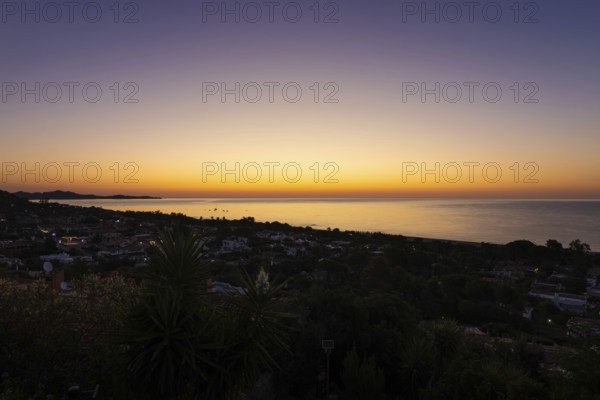 The sun rises on the Costa Rei, a stretch of coastline on the Italian Mediterranean island of Sardinia, Monte Nai, Costa Rei, Sardinia, Italy