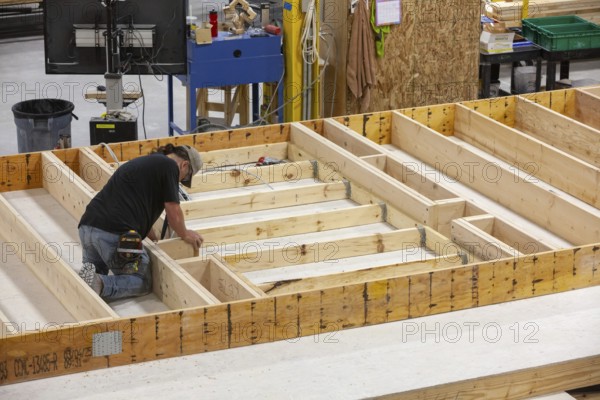 Romulus, Michigan - Workers build apartments in Ginosko Modular 's factory using modular construction methods. The units will be assembled into an apartment building in Detroit for low to moderate income households