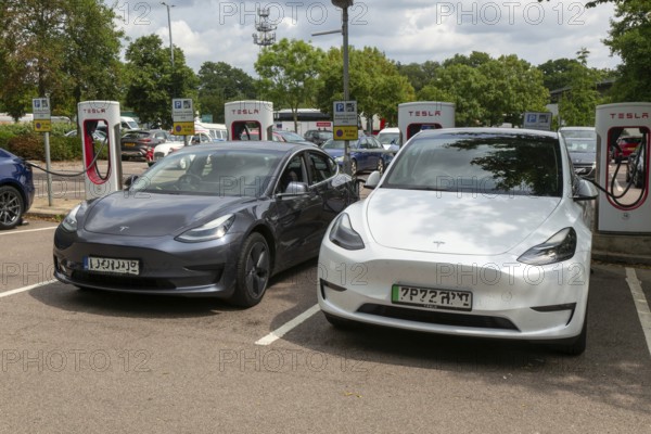 Charging point facility for Tesla electric vehicles at service station, M25 South Mimms services, Hertfordshire, England, UK