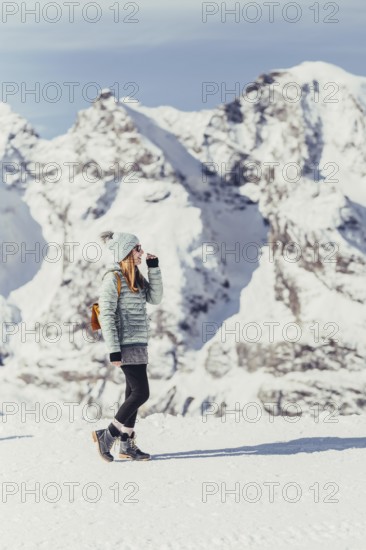 Woman in wintry surroundings in the Engadine in Switzerland
