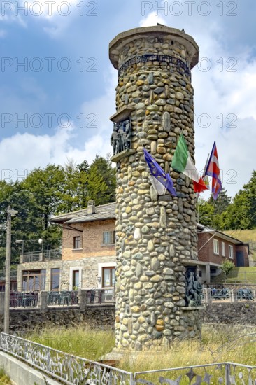 1955 on 1311 m high pass summit of Alpine pass asphalted road pass built round tower erected monument to victims from Valli di Lanzo, Susa, Sangone, Chisone of members involved in Resistenza resistance against Italian fascism and German occupation, Rubiana, Turin, Piedmont, Italy