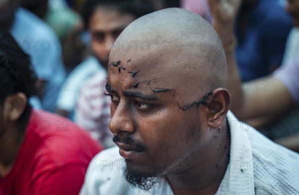 Drivers affiliated with Ola, Uber, and Rapido, under the banner of the Assam State Drivers' Union and the All Assam Cab Welfare Federation, shaved their heads in protest in Guwahati, India, on July 22, 2025. The demonstration held to highlight their demands for fair fare rates, regulation of aggregator commissions, and access to social security and welfare benefits