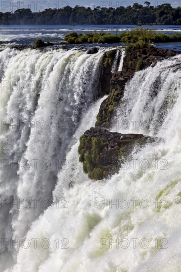 Close-up of a waterfall with rock intrusion, The Iguazu Falls between Argentina and Brazil
