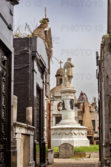 Burial site next to church and dome, architecture in sacred style, La Recoleta cemetery in Buenos Aires Argentina