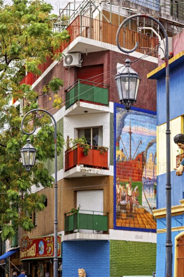 Colourful building with balconies and murals in a lively neighbourhood, the colourful city and tango district of La Bocca in Buenos Aires Argentina