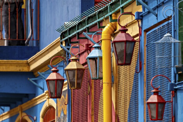 Detailed view of colourful lanterns in front of vividly painted facades, The colourful city and tango district La Bocca in Buenos Aires Argentina