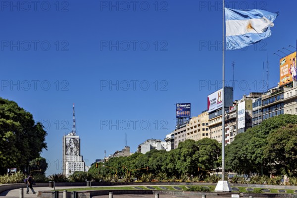 Argentinian flag flies over an urban scenery with buildings and blue sky, The skyline of the city of Buenos Aires Argentina