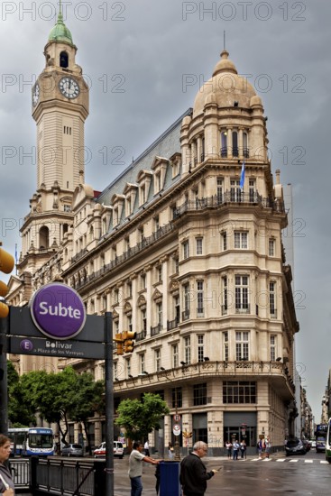 A Subte entrance near an imposing historic building and a striking clock tower, Historic buildings in the city of Buenos Aires Argentina